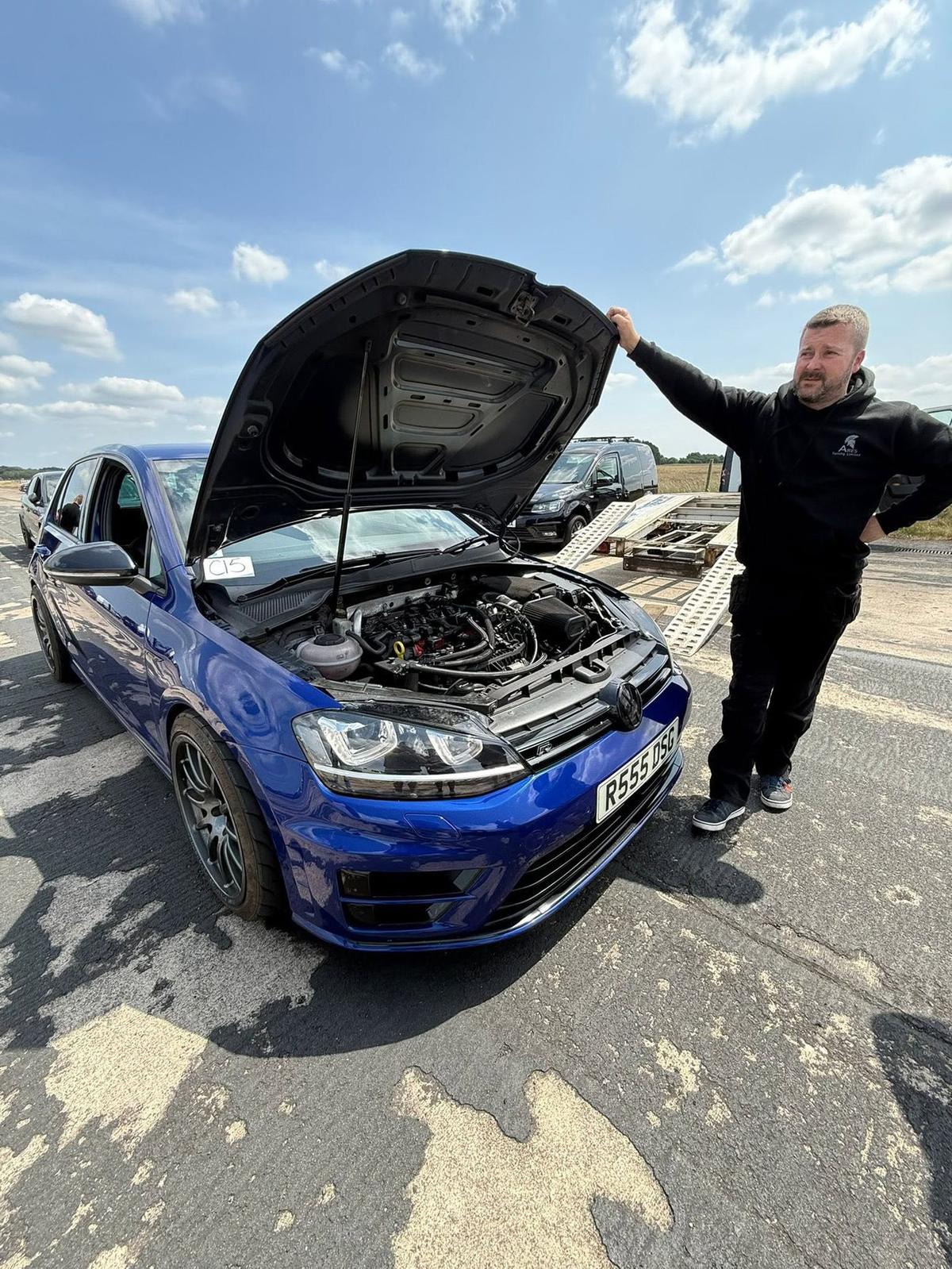 ARES Tuning founder with the shop Golf R, bonnet up